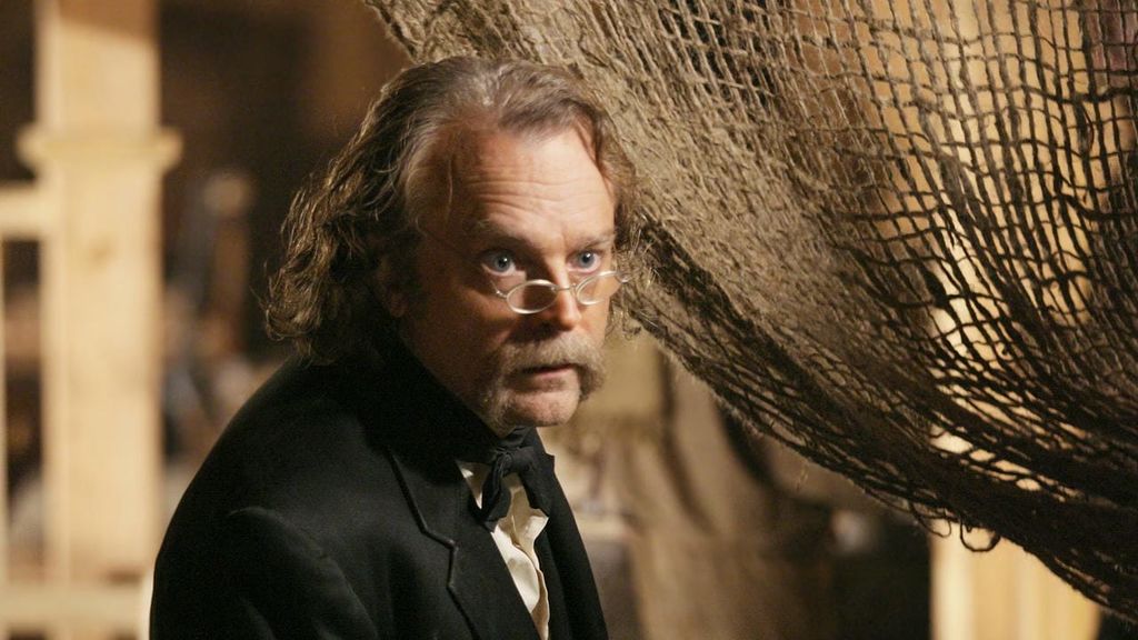 Brad Dourif (Micah Bell szerepében)